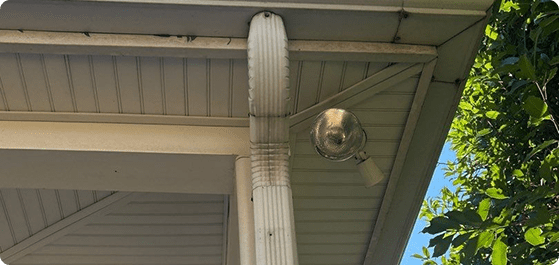 House gutter system directing rainwater away safely