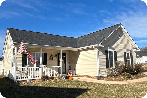 Ranch-style modular home with vinyl siding porch